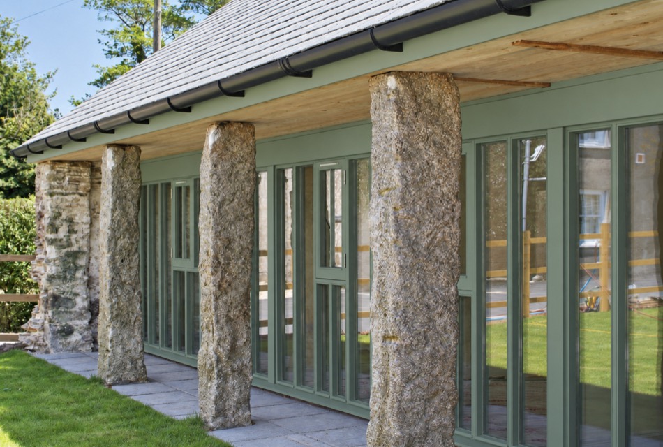 Granite pillars retained in a converted building with new glazing