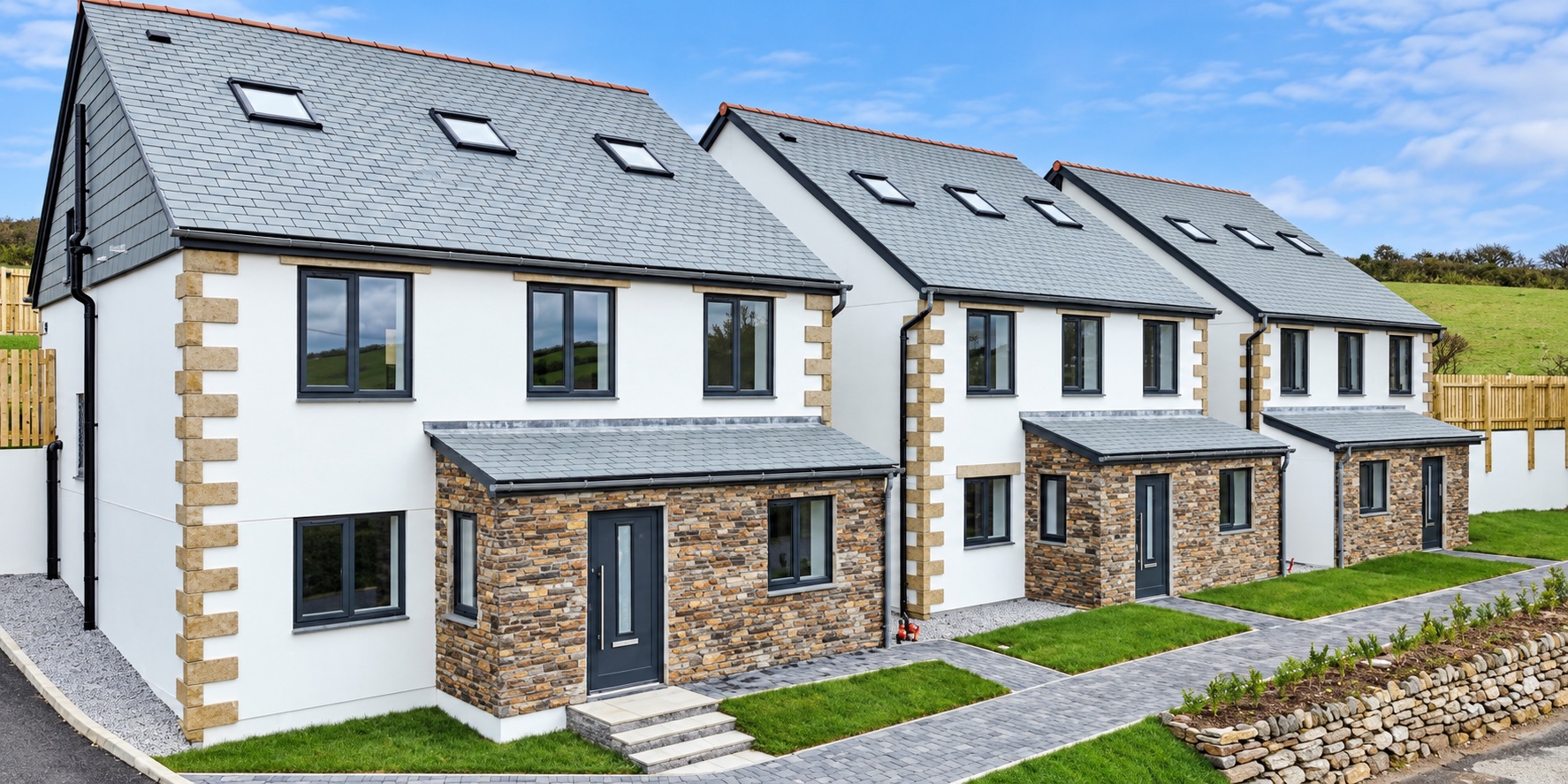 Three completed houses at Trewarmett